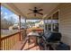 View of the back deck featuring a gas grill, outdoor dining set and neighborhood views at 36 Deep Woods Ln, Cameron, NC 28326