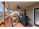 View of the back deck featuring a gas grill, outdoor dining set and neighborhood views at 36 Deep Woods Ln, Cameron, NC 28326