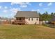 Spacious backyard featuring a wood deck, and a well maintained lawn with a wood fence at 36 Deep Woods Ln, Cameron, NC 28326