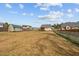 Expansive backyard with lush lawn, a storage shed, bordered by a wooden fence, great for outdoor enjoyment at 36 Deep Woods Ln, Cameron, NC 28326