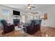 Elegant dining area featuring a chandelier, hardwood floors, and an open connection to the kitchen at 36 Deep Woods Ln, Cameron, NC 28326