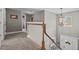 Upstairs hallway with staircase and light fixture at 36 Deep Woods Ln, Cameron, NC 28326