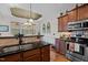 This beautiful kitchen features dark countertops and modern stainless steel appliances at 36 Deep Woods Ln, Cameron, NC 28326