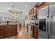 Well-designed kitchen features stainless steel appliances and lovely wood cabinets at 36 Deep Woods Ln, Cameron, NC 28326