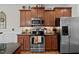 Well-equipped kitchen with wood cabinets, stainless steel appliances, and stylish countertops at 36 Deep Woods Ln, Cameron, NC 28326