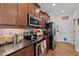 Well-equipped kitchen with wood cabinets, stainless steel appliances, and stylish countertops at 36 Deep Woods Ln, Cameron, NC 28326