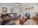 Comfortable living room featuring leather furniture, hardwood floors, and ample natural light at 36 Deep Woods Ln, Cameron, NC 28326