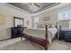 Comfortable main bedroom with a decorative ceiling, plush carpet, and dresser at 36 Deep Woods Ln, Cameron, NC 28326