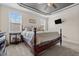Cozy main bedroom with a decorative ceiling, plush carpet, and ample natural light at 36 Deep Woods Ln, Cameron, NC 28326