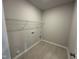 Laundry room with tile floor, shelving and washer/dryer hook-ups at 4012 Shadbush St, Raleigh, NC 27616