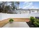 Fenced backyard with concrete patio and small shrubbery at 4220 Congleton Pl, Durham, NC 27703