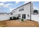 Rear exterior view of the home, featuring a patio and fenced yard at 4220 Congleton Pl, Durham, NC 27703