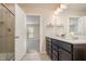 Bathroom boasts double sink vanity, framed mirror, and a glass shower at 4220 Congleton Pl, Durham, NC 27703