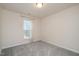 Neutral bedroom with carpet, a window, and a ceiling light at 4220 Congleton Pl, Durham, NC 27703