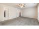 Bedroom featuring neutral carpet, ceiling fan, and a walk-in closet at 4220 Congleton Pl, Durham, NC 27703