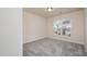 Bedroom with neutral carpet and window allowing ample natural light at 4220 Congleton Pl, Durham, NC 27703