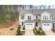 Exterior of home features garages, neutral siding, and simple landscaping at 4220 Congleton Pl, Durham, NC 27703