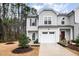 Charming two-story home with gray siding, manicured landscaping, and attached one-car garage at 4220 Congleton Pl, Durham, NC 27703
