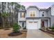 Charming two-story home with gray siding, manicured landscaping, and attached one-car garage at 4220 Congleton Pl, Durham, NC 27703