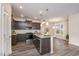 Charming kitchen with gray cabinets, granite countertops, and stainless steel appliances at 4220 Congleton Pl, Durham, NC 27703