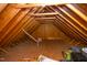 An attic space showing the exposed roof trusses, floor, and plumbing at 4516 Ocean Crest Cir, Raleigh, NC 27603