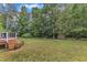 View of home's expansive backyard and shed from the edge of the back deck at 4516 Ocean Crest Cir, Raleigh, NC 27603