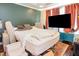 Large primary bedroom with accent wall, featuring an adjustable bed frame and plenty of space at 4516 Ocean Crest Cir, Raleigh, NC 27603