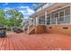 This outdoor deck offers space for dining and entertaining, with its own barbeque pit, seating, and string lights at 4516 Ocean Crest Cir, Raleigh, NC 27603
