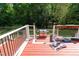 View of a deck with railings and stairs to the backyard with a grill at 4516 Ocean Crest Cir, Raleigh, NC 27603