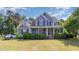 Charming two-story home featuring a welcoming front porch and well-maintained landscaping at 4516 Ocean Crest Cir, Raleigh, NC 27603