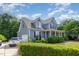 Beautiful two-story home with a garage, lush landscaping, and an inviting, classic facade at 4516 Ocean Crest Cir, Raleigh, NC 27603