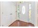 Welcoming foyer with hardwood floors, a stylish front door, and a closet at 4516 Ocean Crest Cir, Raleigh, NC 27603