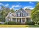 Charming two-story home with a welcoming front porch and beautifully manicured landscaping at 4516 Ocean Crest Cir, Raleigh, NC 27603