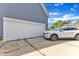 A two car garage is located on the side of this beautiful home with an adjacent driveway and a white SUV parked on the driveway at 4516 Ocean Crest Cir, Raleigh, NC 27603