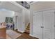 Bright hallway featuring hardwood floors, staircase, and closet at 4516 Ocean Crest Cir, Raleigh, NC 27603