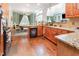 Modern kitchen with granite countertops and stainless steel appliances, open to the dining area at 4516 Ocean Crest Cir, Raleigh, NC 27603