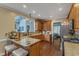 Well-lit kitchen boasts granite countertops, hardwood floors, and views into other living spaces at 4516 Ocean Crest Cir, Raleigh, NC 27603