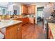 Spacious kitchen boasts wood cabinets, granite counters, stainless steel appliances, and hardwood floors at 4516 Ocean Crest Cir, Raleigh, NC 27603