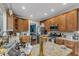 Kitchen with granite counters, wood cabinets, and modern appliances at 4516 Ocean Crest Cir, Raleigh, NC 27603