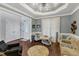 Elegant living room featuring hardwood floors, high ceilings, and a stained-glass accented doorway at 4516 Ocean Crest Cir, Raleigh, NC 27603