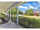 Inviting front porch offers a relaxing outdoor space with neighborhood views and black iron railing at 4516 Ocean Crest Cir, Raleigh, NC 27603