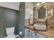 Charming powder room with stone sink and gold framed mirror at 4516 Ocean Crest Cir, Raleigh, NC 27603