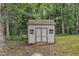 Exterior shot of a simple storage shed with double doors and two windows at 4516 Ocean Crest Cir, Raleigh, NC 27603