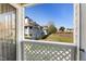 View from the balcony overlooking the community, with well maintained lawn and tennis courts at 4911 Hollenden Dr # 208, Raleigh, NC 27616