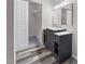 Classic dark wood vanity with marble countertop in a bright bathroom at 4911 Hollenden Dr # 208, Raleigh, NC 27616