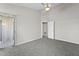 Open bedroom features carpeting, ceiling fan, and sliding glass door at 4911 Hollenden Dr # 208, Raleigh, NC 27616