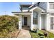 Exterior of building showcasing entrance with plants and greenery at 4911 Hollenden Dr # 208, Raleigh, NC 27616