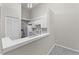 The kitchen featuring white cabinets, appliances, and a convenient layout at 4911 Hollenden Dr # 208, Raleigh, NC 27616