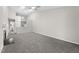 Bright living room with neutral walls, plush carpet, ceiling fan and lots of natural light at 4911 Hollenden Dr # 208, Raleigh, NC 27616