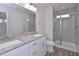 Modern bathroom features a double vanity, granite countertop, and glass enclosed shower at 509 Sherron Rd # 36, Raleigh, NC 27703